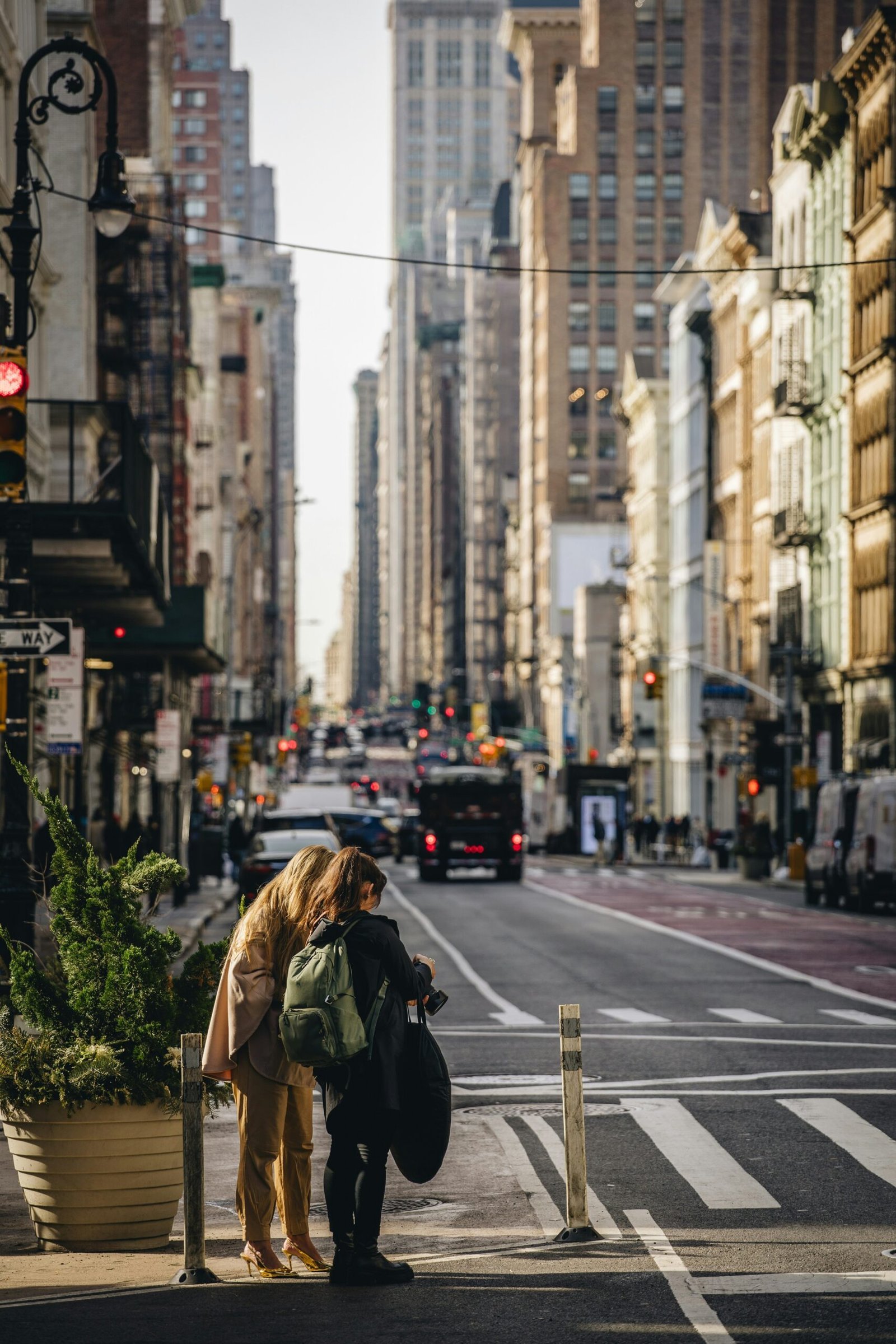 A couple of people that are standing in the street